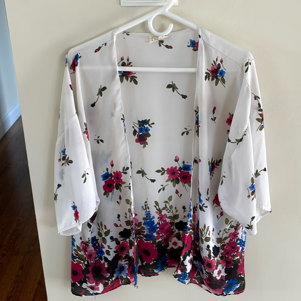 LA hearts, shawl with sleeve holes, hundred percent polyester one size fits all